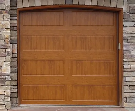 Wood-toned garage door after replacement