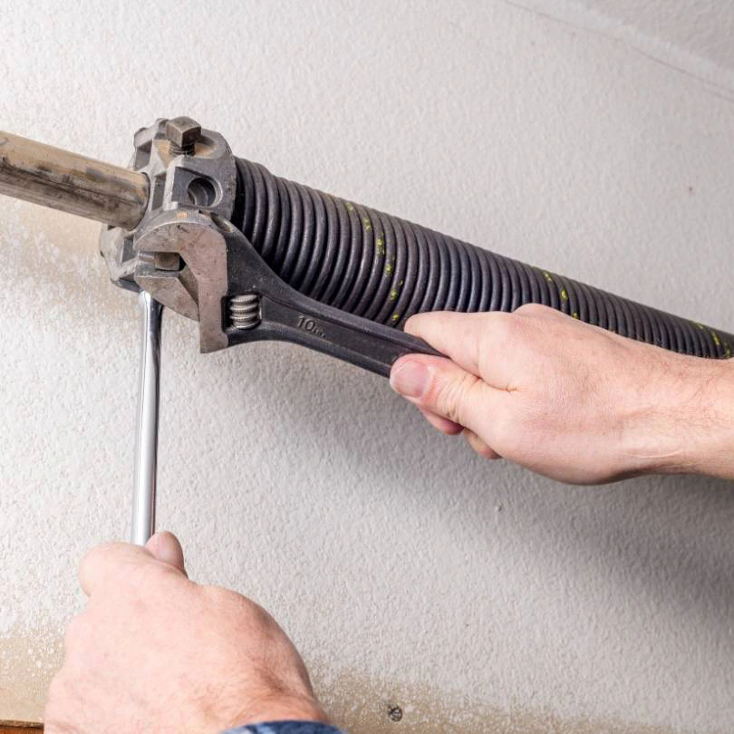 Garage door torsion spring and lifting hardware