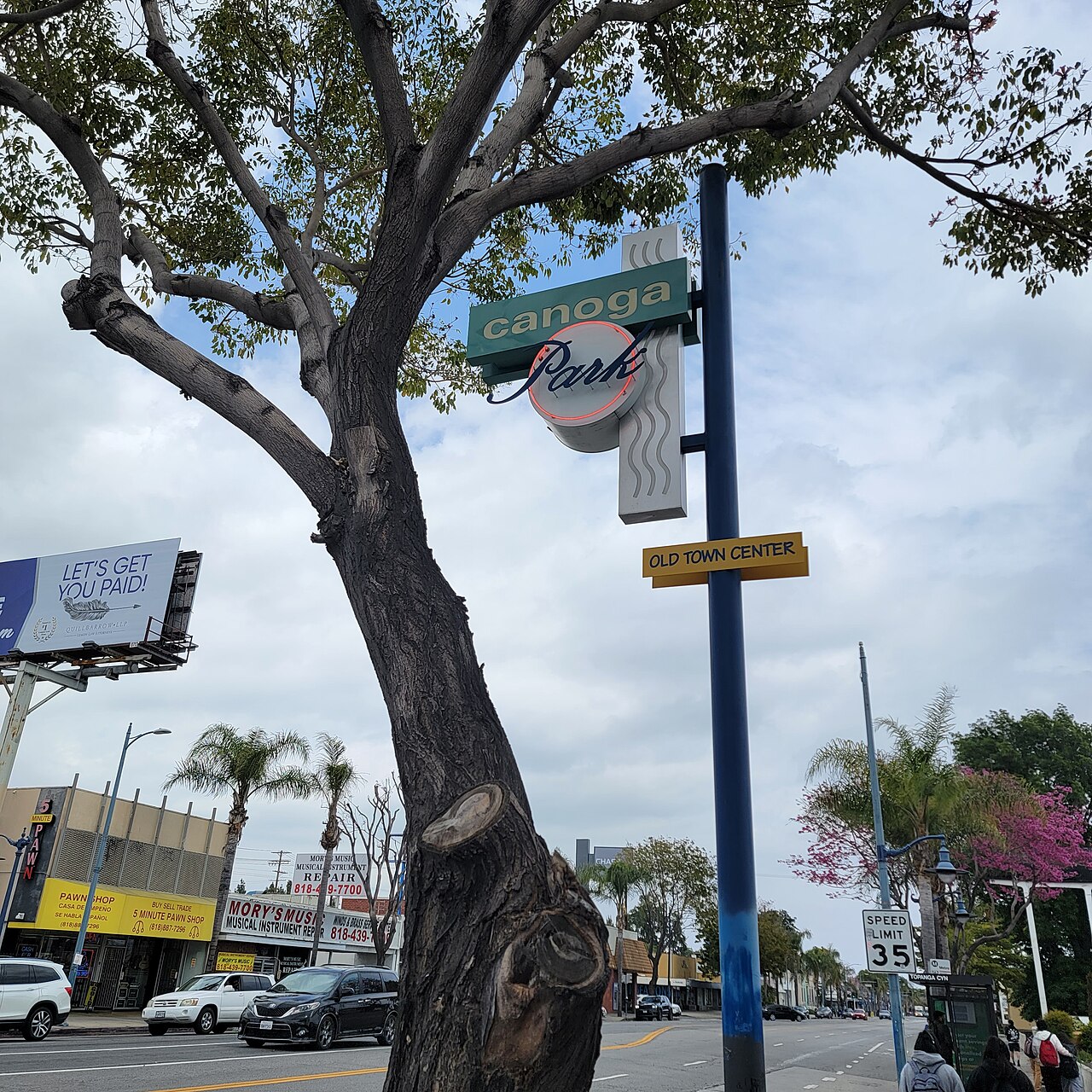 Street scene with the Old Town Canoga Park sign.