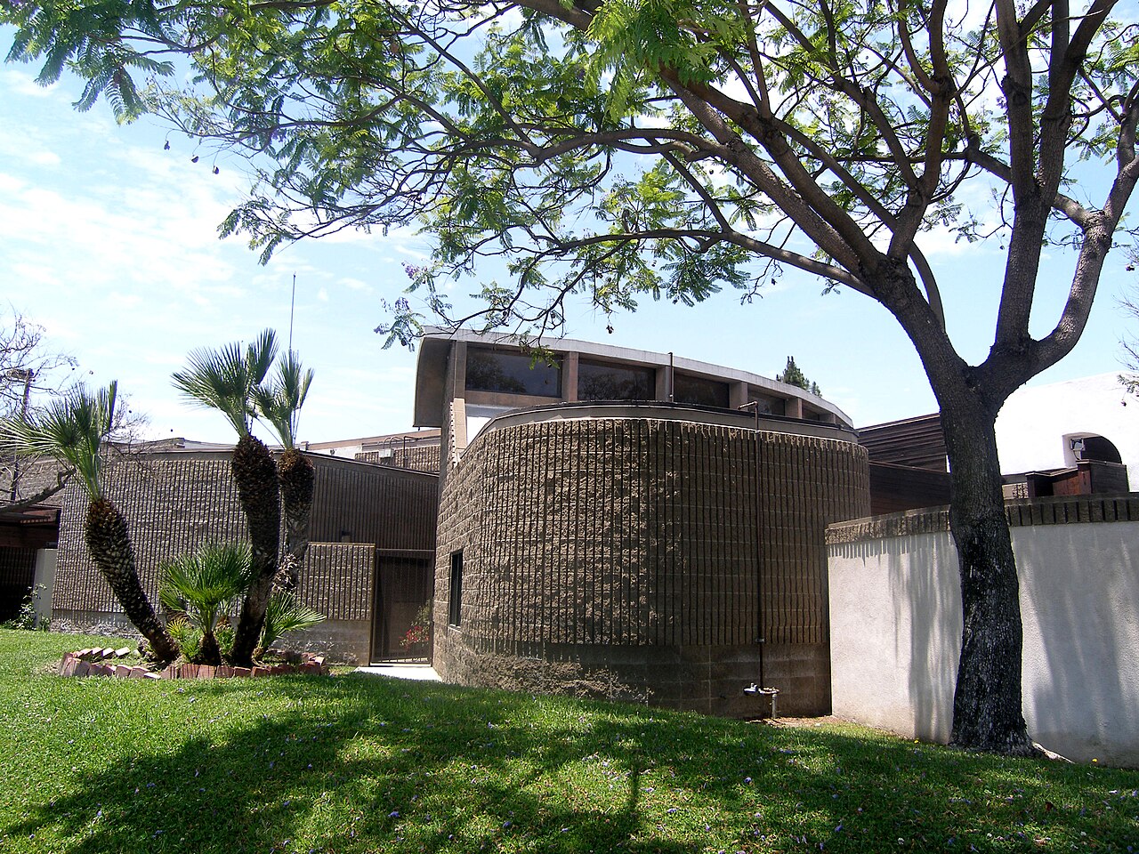 Hawaiian Gardens Civic Center exterior with trees and lawn.