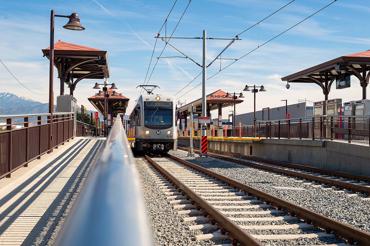 Irwindale light rail station with train and mountain backdrop, January 2016.