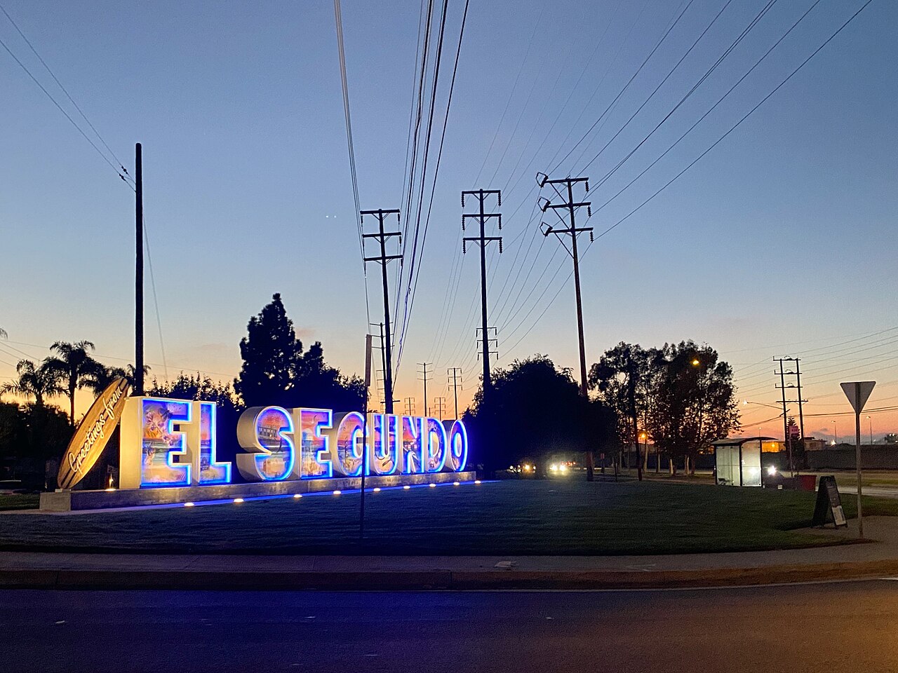 Illuminated El Segundo welcome sign at dusk.
