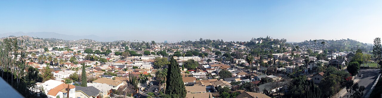 Wide panorama of El Sereno homes and surrounding hills.