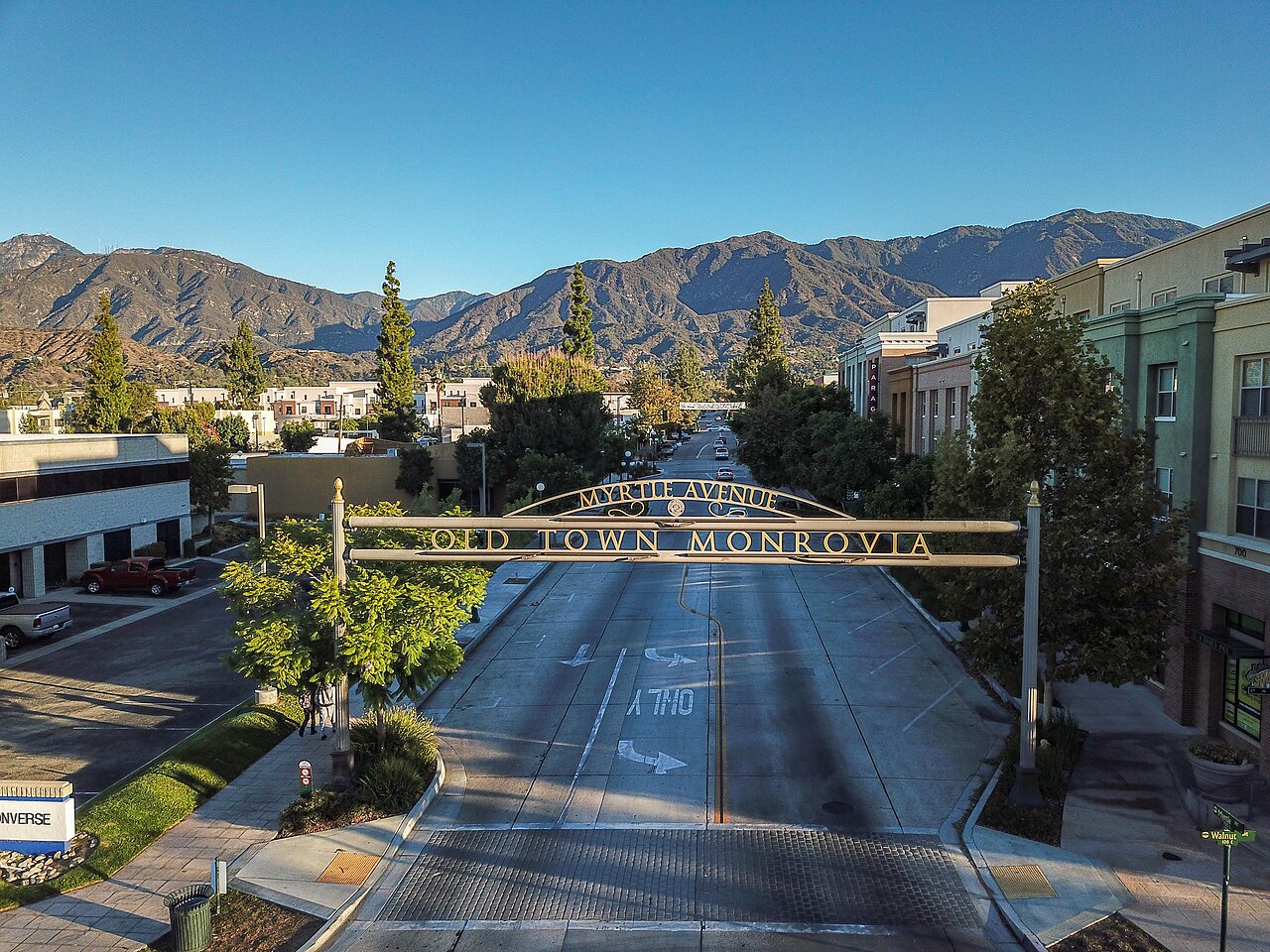 Old Town Monrovia streetscape and gateway with San Gabriel Mountains in the background.