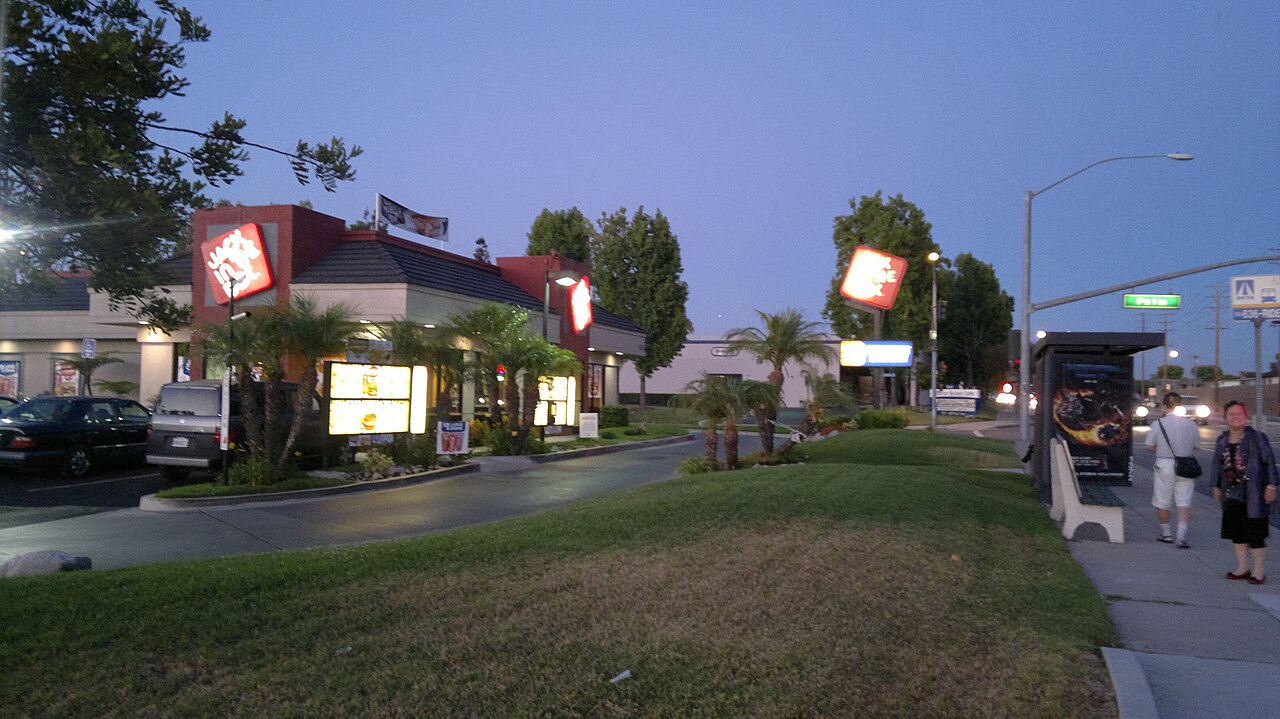 Paramount streetscape at dusk, with landscaped verge and local businesses.
